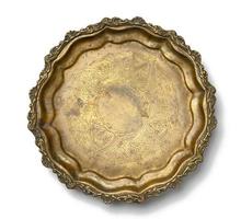 empty copper round vintage plate isolated on white background, fruit dish. photo