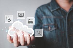 man holding cloud computing diagram show on hand. Data storage.Cloud technology.Secure backup and consistency Networking and internet service concept.Implementing storage technology in business photo