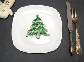 white square plate and a vintage knife with a fork photo