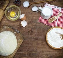 dough made from white wheat flour and ingredients for cooking photo