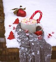 hot chocolate with marshmallow and candy photo