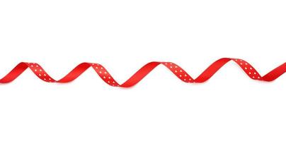 swirling red silk ribbon on white background photo