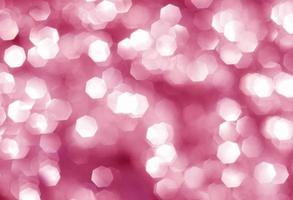 Abstract pink background with a large silver bokeh photo