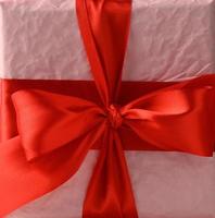 knotted bow on gift and red silk ribbon photo