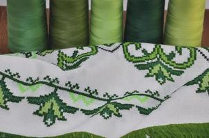 Traditional  embroidered towel bright green thread in hoop photo