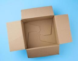 open square empty cardboard brown box for packing and shipping things photo