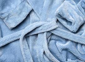 a fragment of a gray-blue plush robe with a belt photo