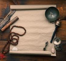 Tibetan singing copper bowl with a wooden clapper , objects for meditation and alternative medicine, top view. Plunging into a trance photo