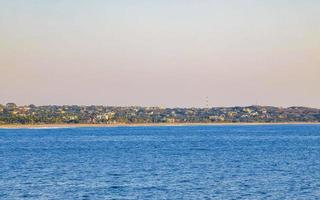 Beautiful rocks cliffs surfer waves panorama view Puerto Escondido Mexico. photo