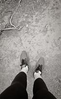 Sports shoes from a woman from above, African red floor. photo