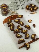 Choco cashew cookies. Chocolate cookies with cashew nut topping. photo