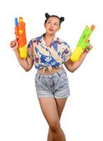 Portrait smiley woman in Songkran festival with water gun photo