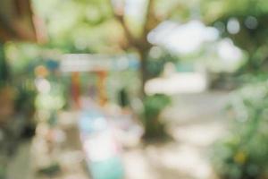 defocused bokeh and blur background of garden trees in sunlight. photo