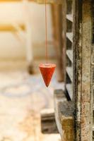 pendulum with plum for finding vertical line photo