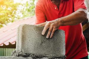 bricklayer man working build for construction at home photo