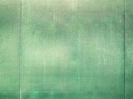 Green concrete wall texture and background with copy space photo