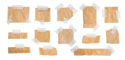 Brown paper labels attached set with sticky tape on isolate white background photo