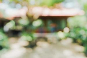 defocused bokeh and blur background of garden trees in sunlight. photo