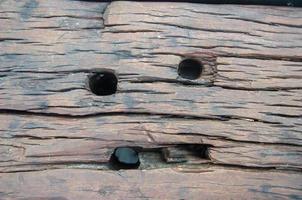 Brown natural wood grain surface like a smiling human face. photo