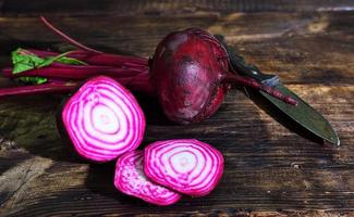 Raw red beets are cut into pieces photo