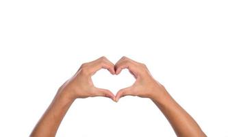 Man hands making a heart shape on a white isolated background photo