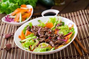 Salad with beef teriyaki photo