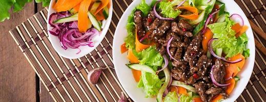 Salad with beef teriyaki photo