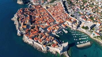 Aerial drone view of the Old historic city of Dubrovnik in Croatia, UNESCO World Heritage site. Famous tourist attraction in the Adriatic Sea. Fortified old city. Tourism and travel to Croatia. video