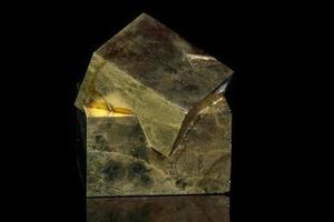 Macro mineral stone Pyrite on a black background photo