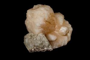 Macro mineral stone Stilbite on Apophyllite on a black background photo