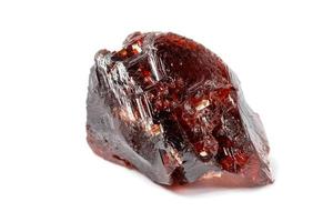 Macro mineral stone Garnet Spessartine on a white background photo