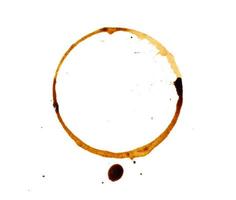 spilled black coffee on a white background. Circular blotprint with fine splashes photo
