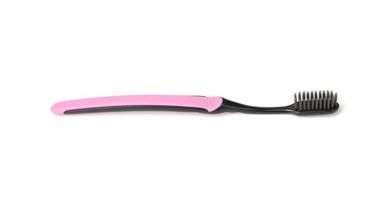 pink plastic toothbrush isolated on white background photo