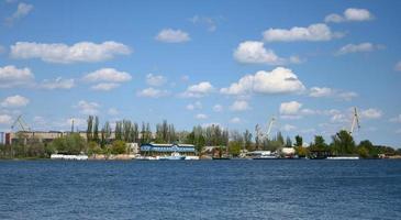 view of the river port with landing stage and cranes on a summer day. Kherson Ukraine photo