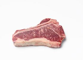 fresh raw piece of beef meat, striploin steakon white background photo