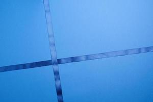 blue silk ribbon crossed on a dark blue background photo