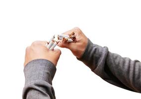 male young holding broken cigarette in hands. health care concept stop quitting smoking. isolated on white background and clipping path photo