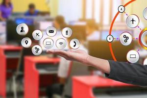 businessman marketing social network future transportation on hand. concept connect computer communicate technology with blur classroom desktop computer background and copy space add text photo