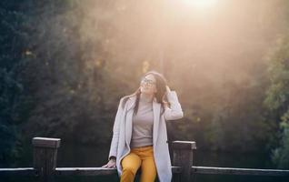 woman outdoors in autumn on sunset photo