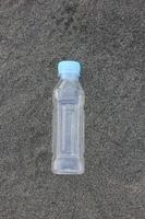 photo of a plain used bottle with daylight