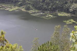 photo of a lake with wide waters, during the day