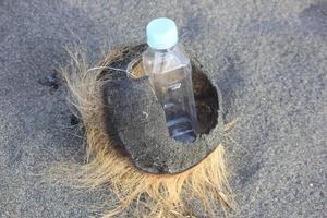 photo of a plain used bottle with daylight