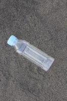 photo of a plain used bottle with daylight