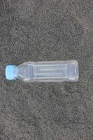 photo of a plain used bottle with daylight