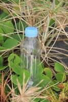 photo of a plain used bottle with daylight