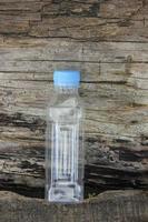 photo of a plain used bottle with daylight