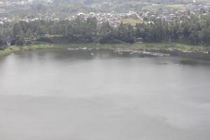 photo of a lake with wide waters, during the day