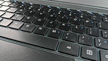 closeup shot of black laptop keyboard. for the background technology concept photo