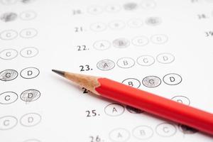 Answer sheets with pencil drawing fill to select choice, education concept. photo