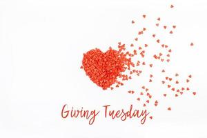 Giving Tuesday concept with red heart on white photo